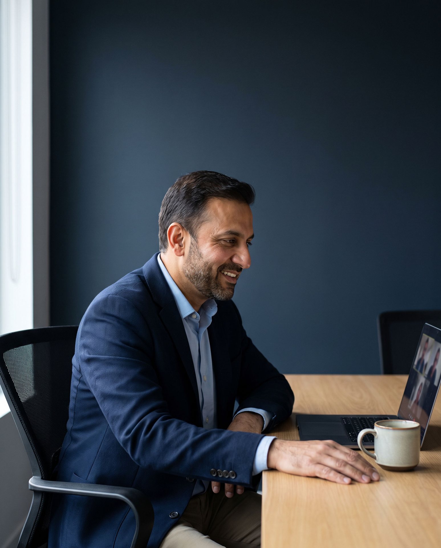 An Elite Solution advisor smiling during a video discovery call